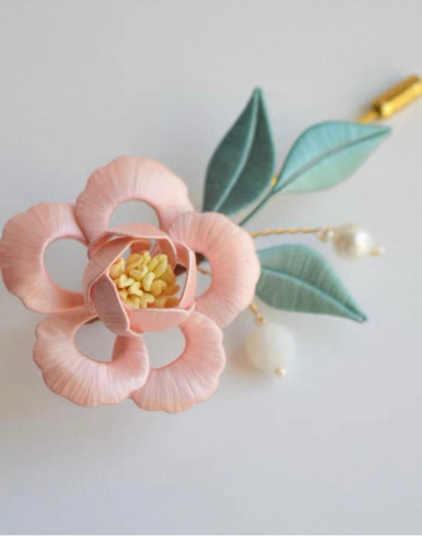 Small floral brooch with delicate botanical design - elegant accessory pin