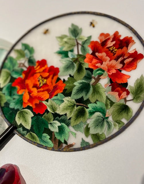 Silk fan detail - delicate silk fabric and craftsmanship close-up