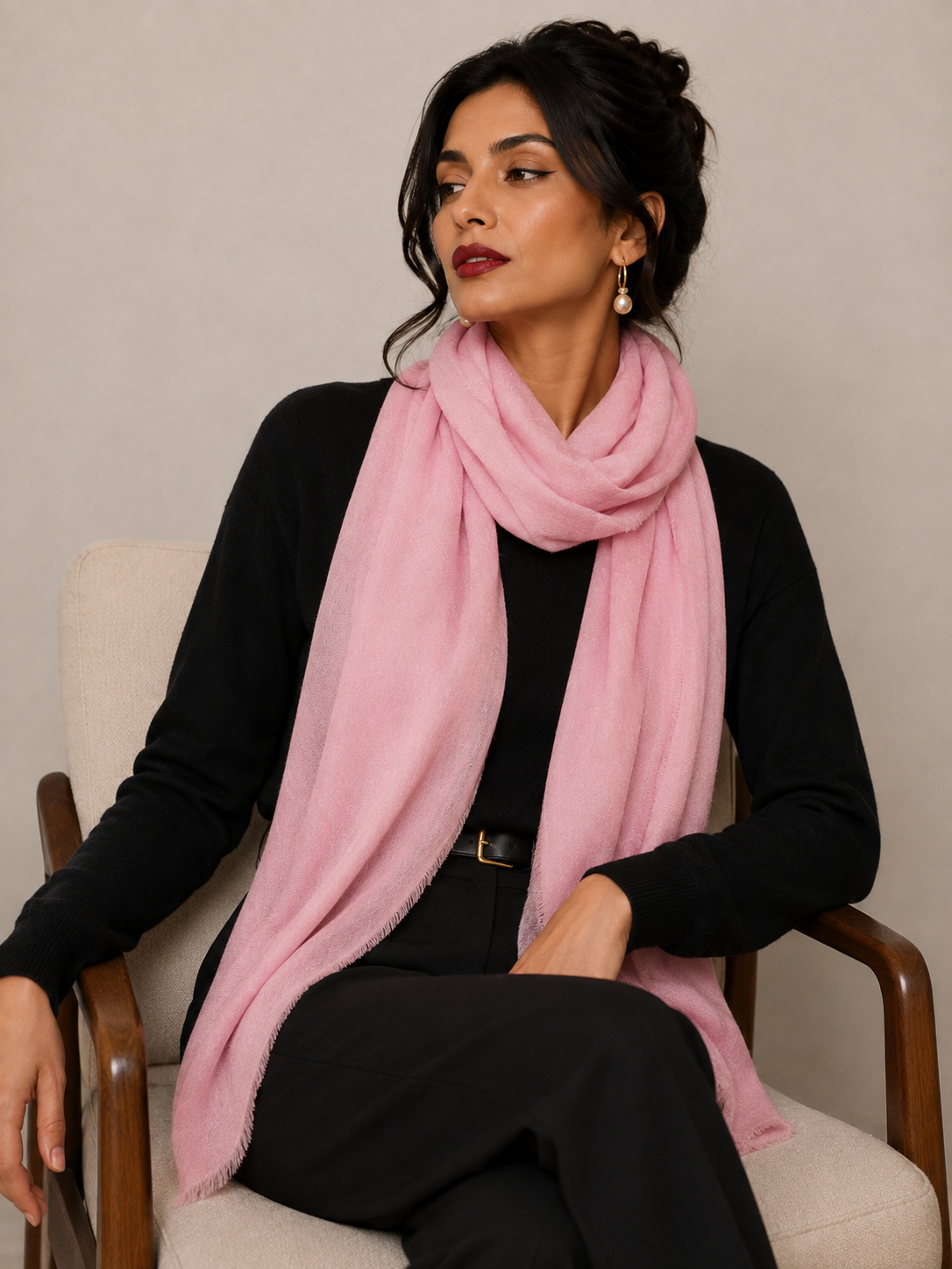 Pink hand loomed shawl in light pink cashmere woven over a black outfit