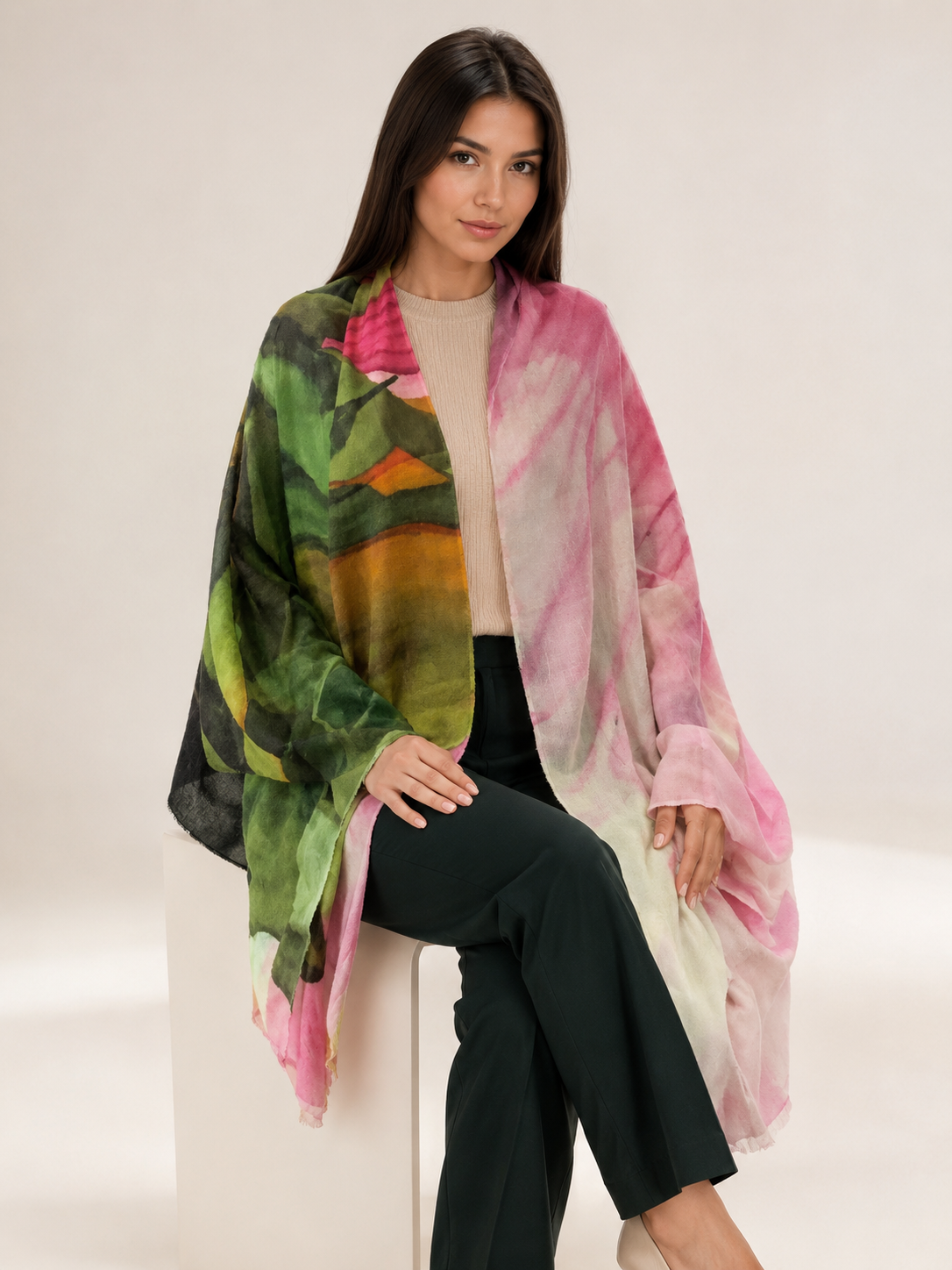 Model wearing a cashmere hand loomed scarf in pastel shades