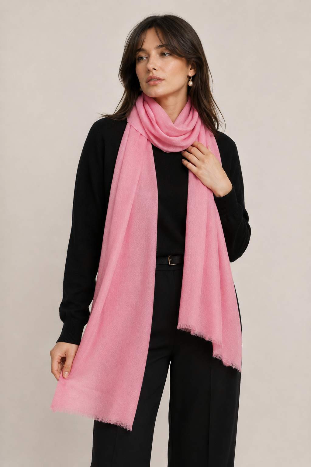 A woman wearing medium pink cashmere shawl 