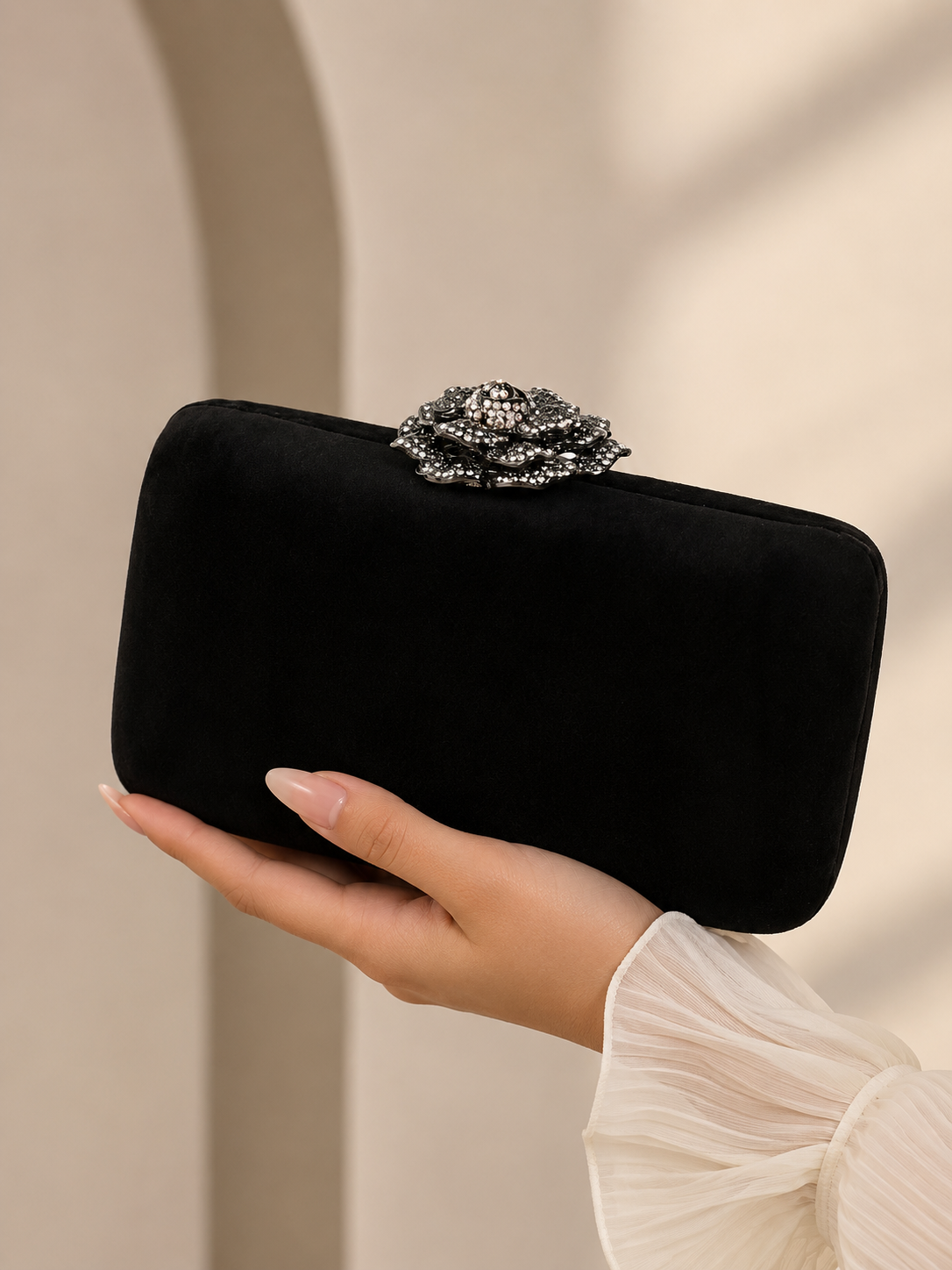 Black clutch with rose style clasp