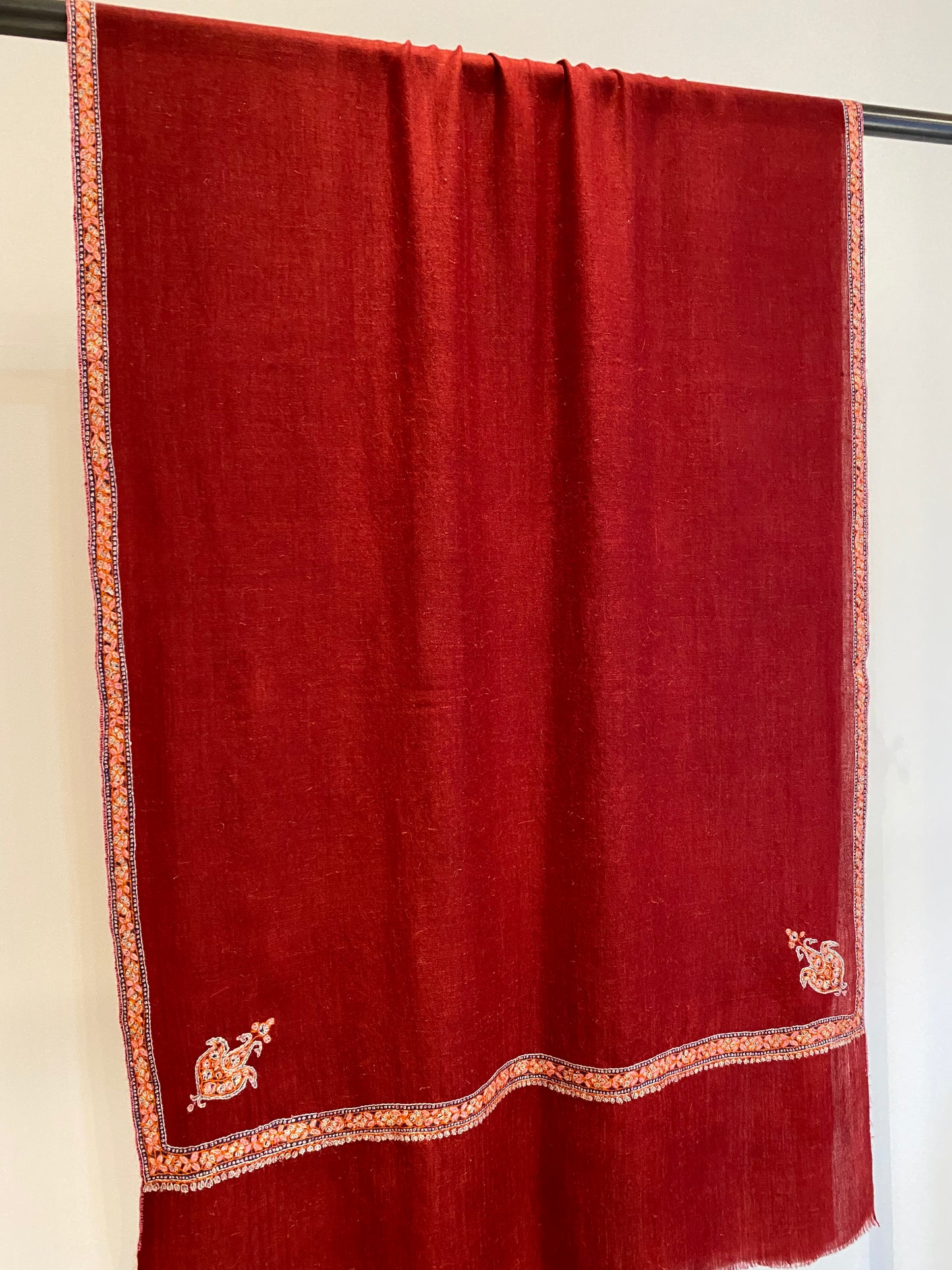 Hand embroidered Kashmiri shawl draped elegantly - artisan craftsmanship