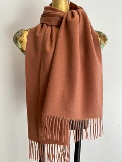 Classic cashmere scarf styled around neck showing versatile wear
