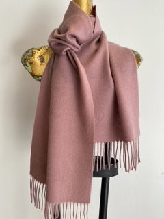 Classic cashmere scarf styled around neck showing versatile wear
