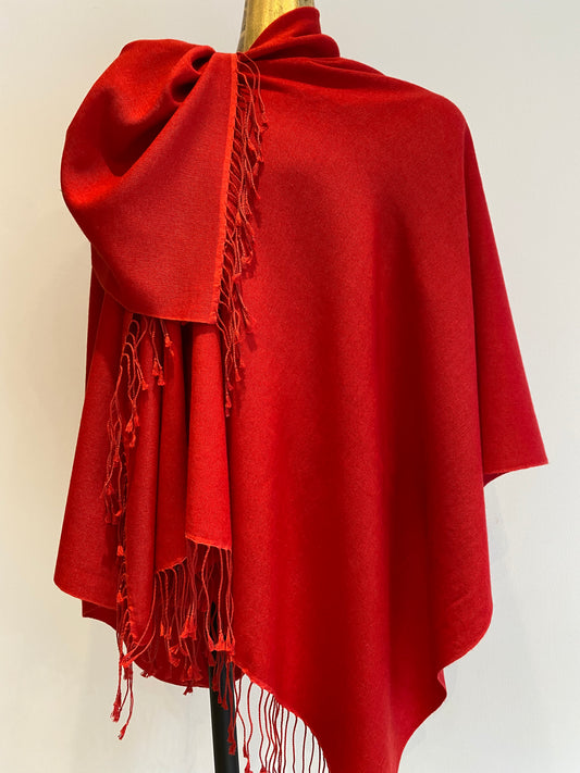 A red pashmina shawl with a lovely drape