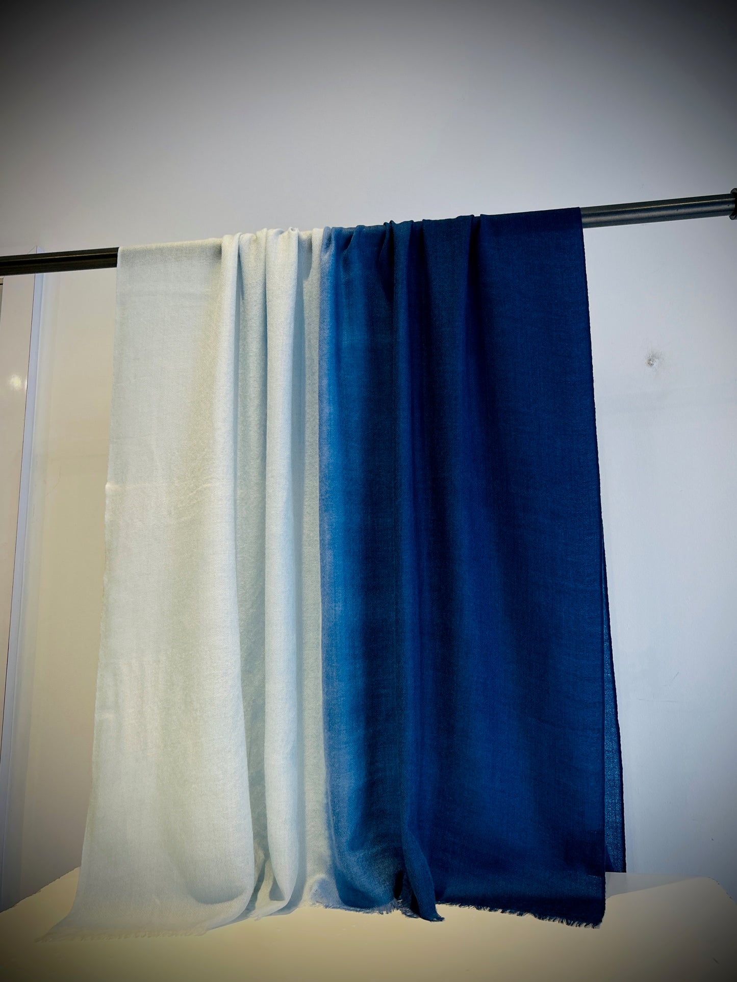 Luxury featherweight cashmere two-tone shawl detail showing color transition and fine weave texture