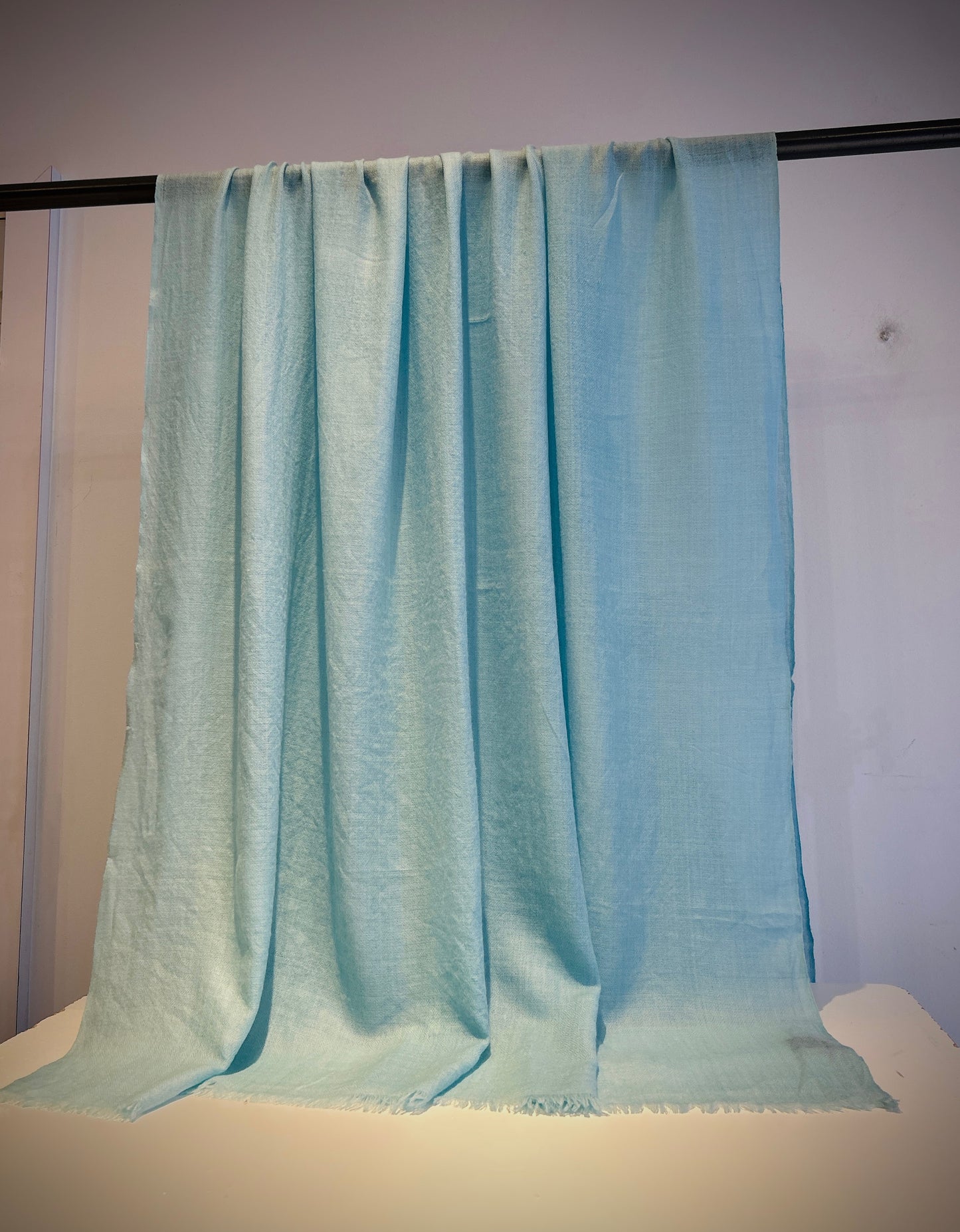 Luxury featherweight cashmere two-tone shawl detail showing color transition and fine weave texture