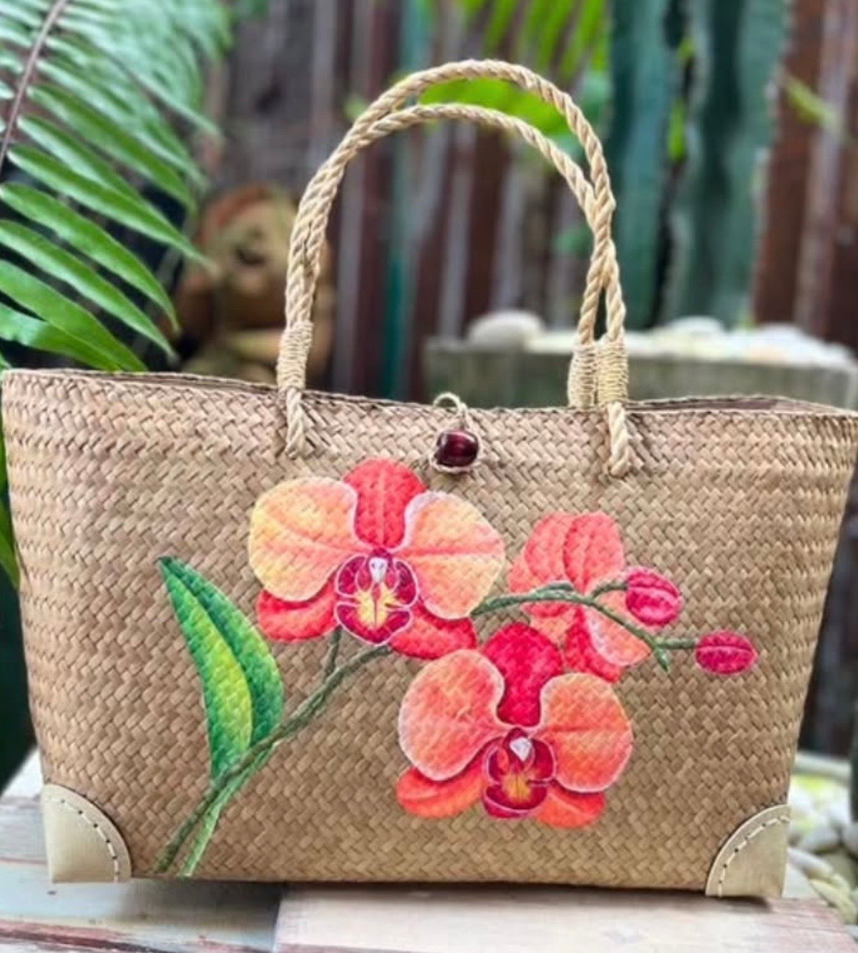 Orange hand painted hand woven handbag