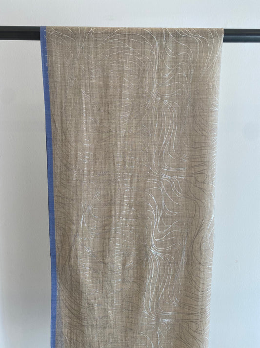 Neutral scarf highlighting timeless neutral tones and soft texture