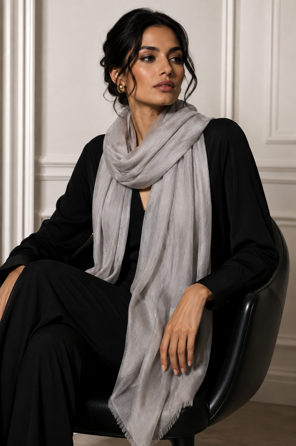 Light cloud gray cashmere shawl worn over a black outfit