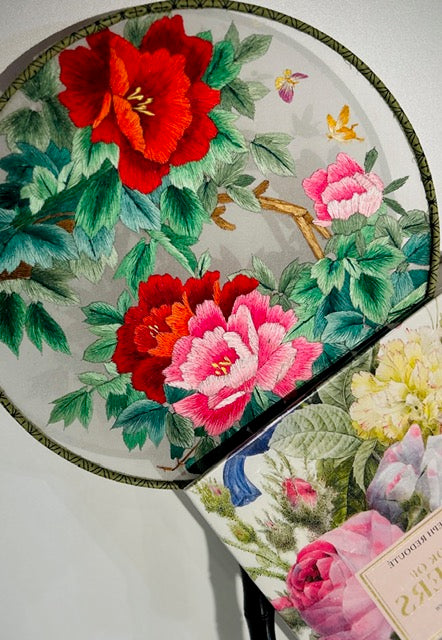 Silk fan showing decorative pattern and artisan details